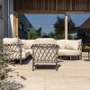 4 Seasons Outdoor Ezra loungeset terre met loungestoel en Volta tafels - sfeer